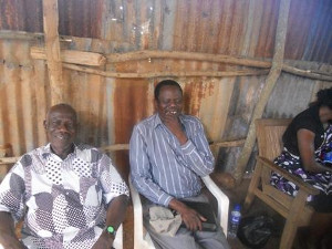 Pastor Isaac Peter Oyako chatting with Rev. Silas Ogwadulai at lunch
