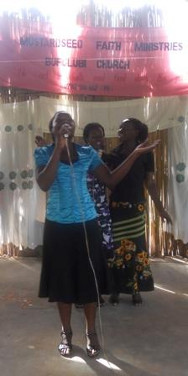 Staff, Sylvia and Rose leading worship