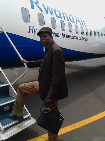 Isaac Peter Oyako boarding RwandAir to return home