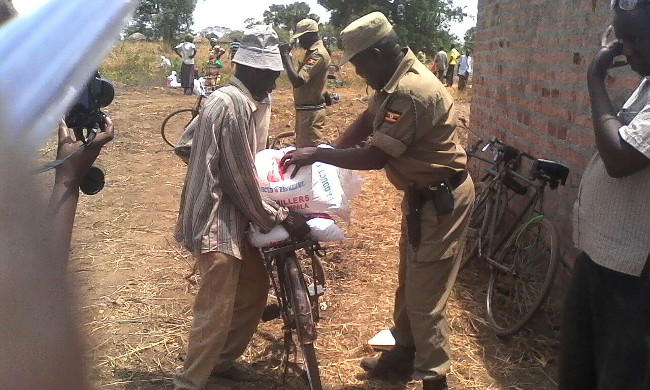 a policeman helping with distributions